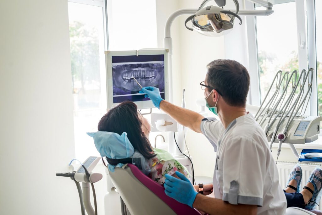 Dentist showing a patient a xray